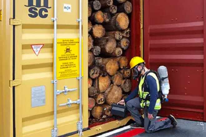 Sealed shipping container under fumigation at a Dubai terminal