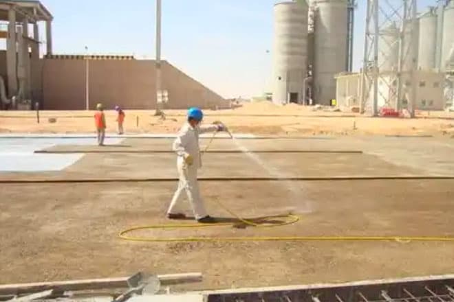 Pre-construction anti-termite barrier being applied to prepared ground before a slab pour