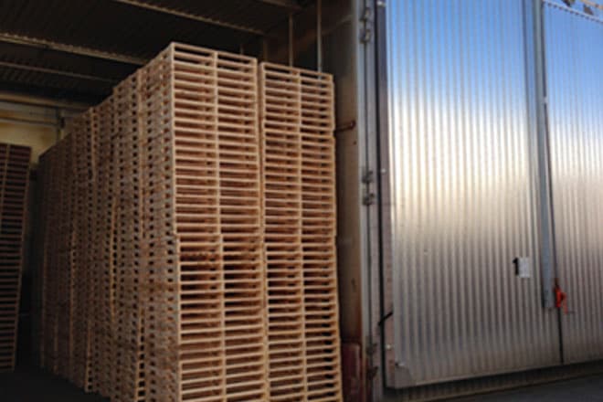 Timber pallets stacked for ISPM 15 heat treatment in Dubai